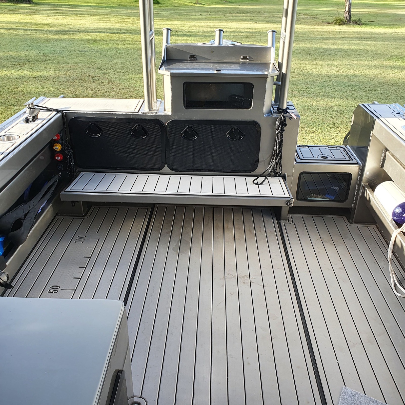 Finished AOMAS deck with grey flooring and storage