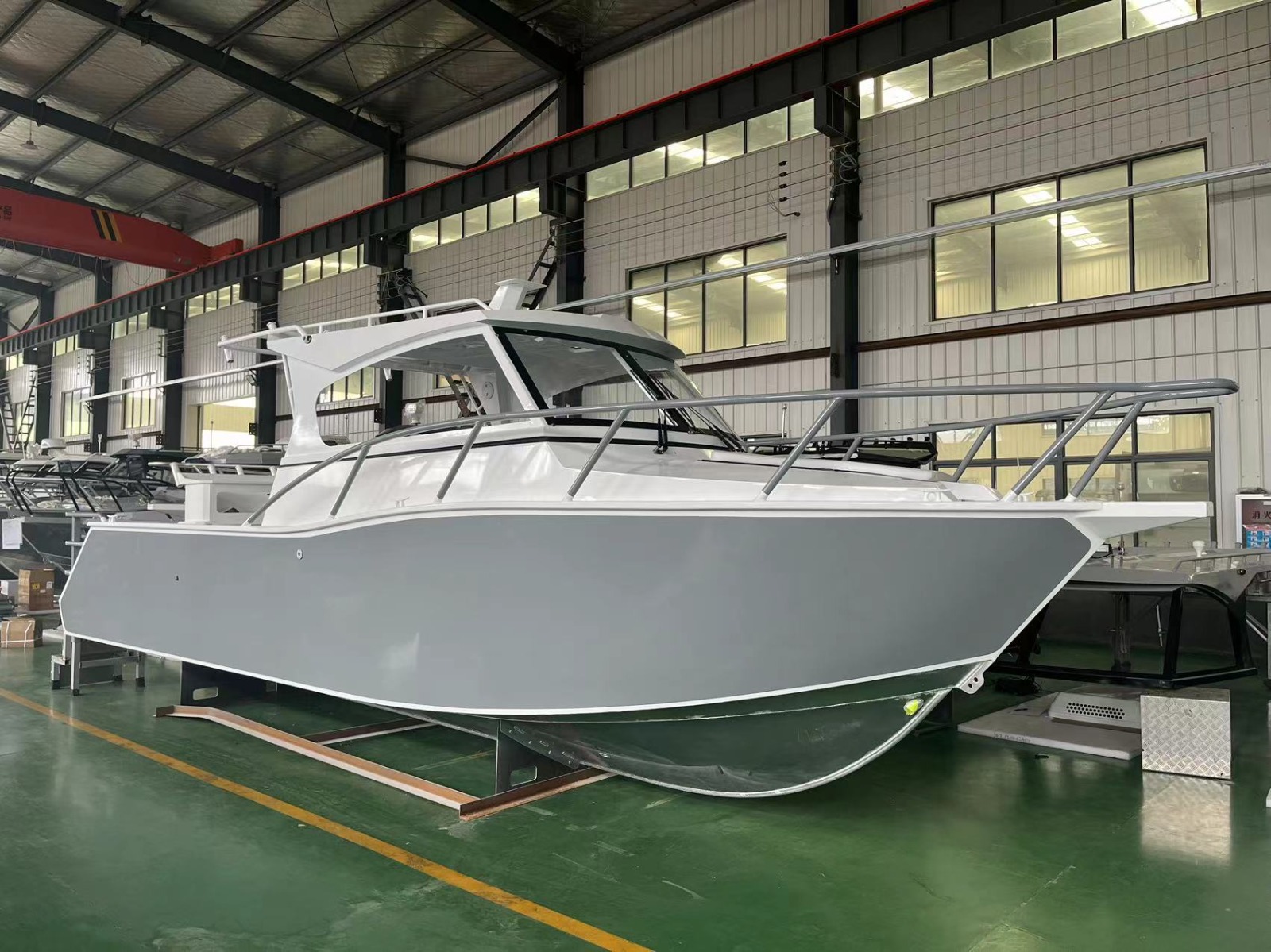 Completed aluminium boat hull and cabin from the side